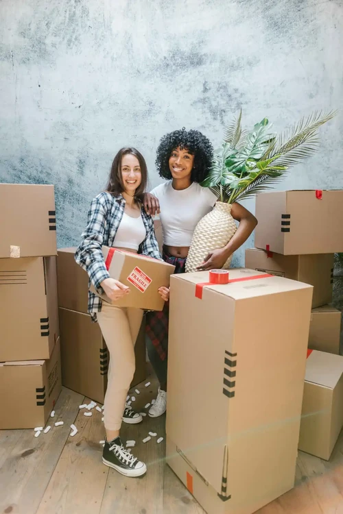 Two women packing up to move to Albuquerque, NM